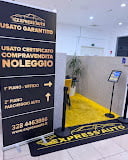 Interior of a modern retail store entrance with black and yellow signage